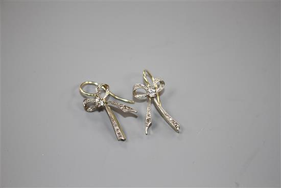 A pair of 20th century yellow metal and diamond set ribbon bow drop earrings, bow 22mm, gross weight 3.8 grams.